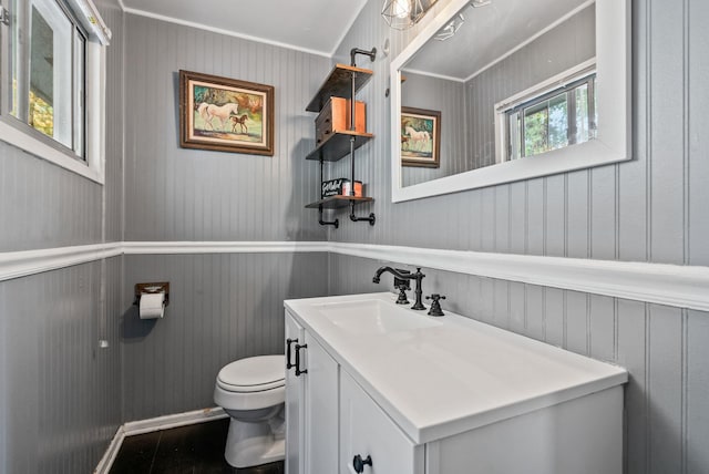 3006 W Francis Ave, Spokane, WA 99205 - half bathroom with toilet, vanity, ornamental molding, and a decorative wall