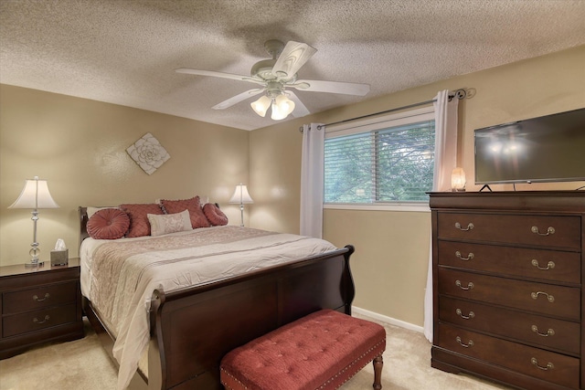1829 S Glenrose Rd, Spokane, WA 99223 - bedroom with light carpet, a textured ceiling, a ceiling fan, and baseboards