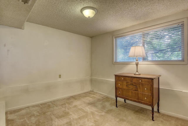 1829 S Glenrose Rd, Spokane, WA 99223 - unfurnished room featuring a textured ceiling, carpet flooring, and baseboards