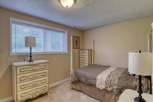 1829 S Glenrose Rd, Spokane, WA 99223 - bedroom with a textured ceiling, light carpet, and baseboards