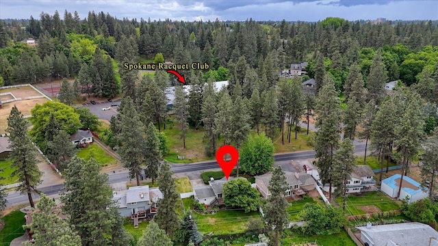 1829 S Glenrose Rd, Spokane, WA 99223 - aerial view of property and surrounding area featuring a heavily wooded area and nearby suburban area