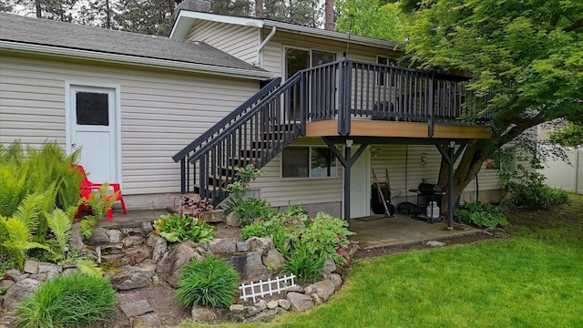 1829 S Glenrose Rd, Spokane, WA 99223 - rear view of property featuring a deck, a chimney, stairs, a lawn, and a shingled roof
