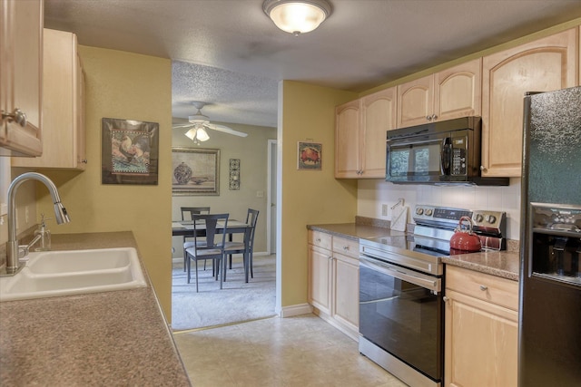 1829 S Glenrose Rd, Spokane, WA 99223 - kitchen with black appliances, light brown cabinets, a sink, ceiling fan, and a textured ceiling