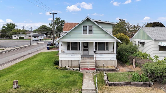 603 E Providence Ave, Spokane, WA 99207 - view of front of home featuring covered porch and a front yard