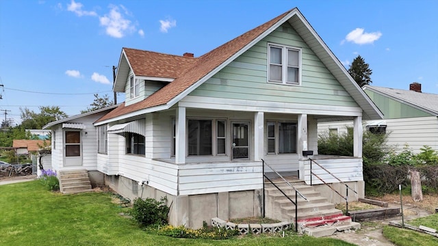 603 E Providence Ave, Spokane, WA 99207 - bungalow-style house with covered porch and a front lawn