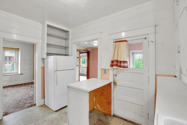 603 E Providence Ave, Spokane, WA 99207 - kitchen featuring freestanding refrigerator, open shelves, a peninsula, white cabinets, and light countertops