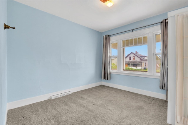 603 E Providence Ave, Spokane, WA 99207 - spare room featuring carpet flooring and baseboards