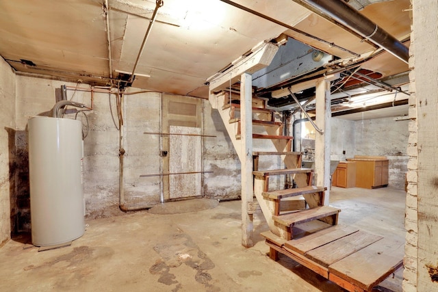 603 E Providence Ave, Spokane, WA 99207 - unfinished below grade area with water heater and stairway