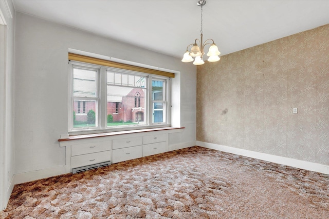 603 E Providence Ave, Spokane, WA 99207 - carpeted empty room with a chandelier and baseboards