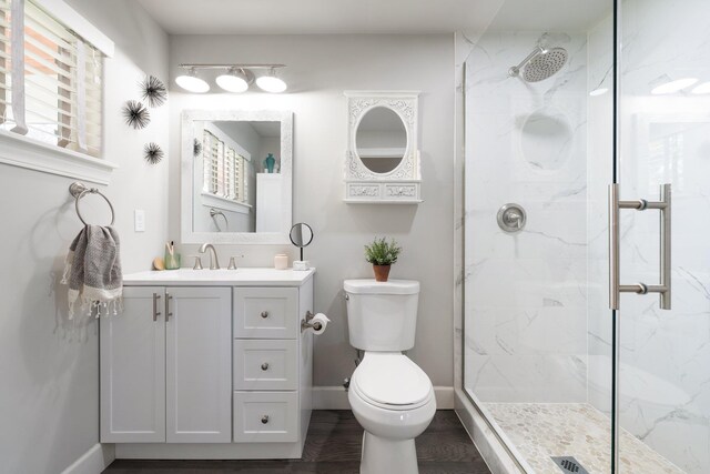 5475 Peggy Way, Deer Park, WA 99006 - bathroom featuring a marble finish shower, toilet, vanity, and wood finished floors