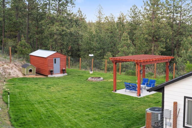 5475 Peggy Way, Deer Park, WA 99006 - view of yard featuring an outdoor fire pit, central AC, and a patio area