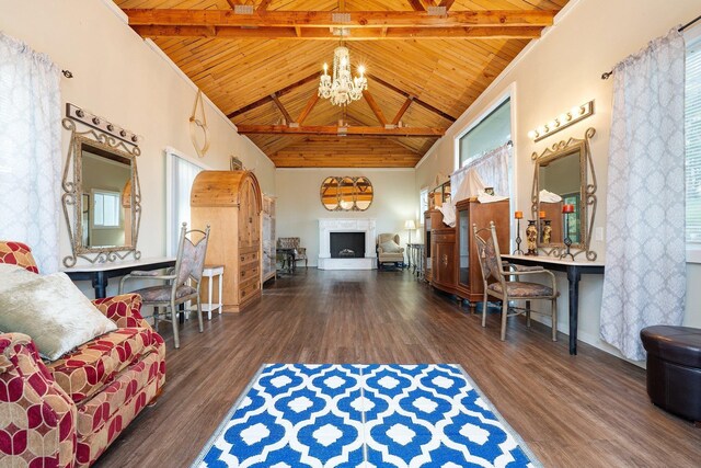 5475 Peggy Way, Deer Park, WA 99006 - living area featuring wood ceiling with exposed beams, a chandelier, wood finished floors, a fireplace, and baseboards