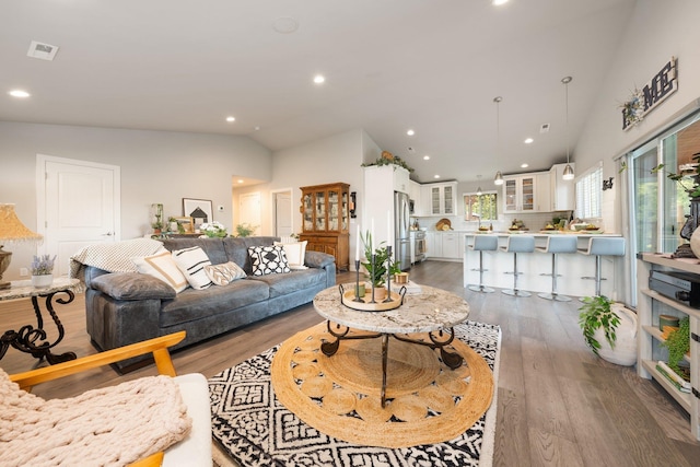 5475 Peggy Way, Deer Park, WA 99006 - living area featuring vaulted ceiling, dark wood-style floors, and recessed lighting