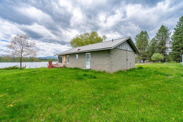472 Snow Berry Ln, Usk, WA 99180 - view of side of home featuring a water view, a yard, and metal roof