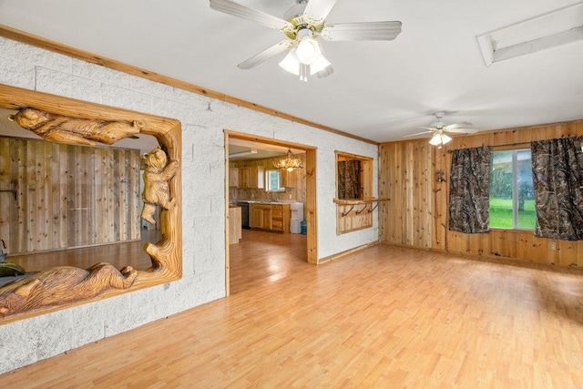 472 Snow Berry Ln, Usk, WA 99180 - living area featuring healthy amount of natural light, wood finished floors, ornamental molding, a chandelier, and wooden walls