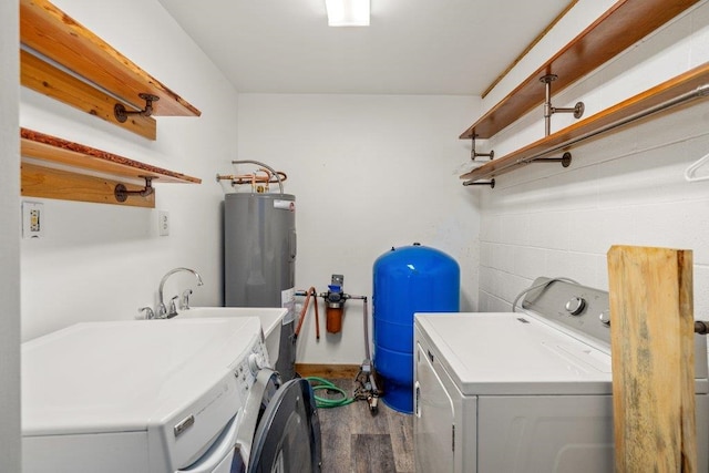 472 Snow Berry Ln, Usk, WA 99180 - laundry room with washer and dryer, wood finished floors, and electric water heater