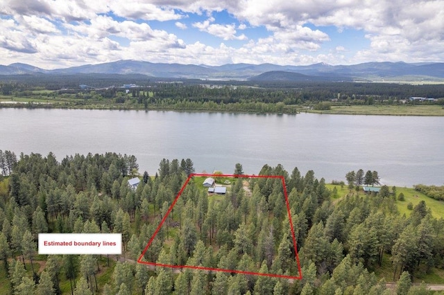 472 Snow Berry Ln, Usk, WA 99180 - view of property location featuring a water and mountain view, a heavily wooded area, and property boundaries highlighted