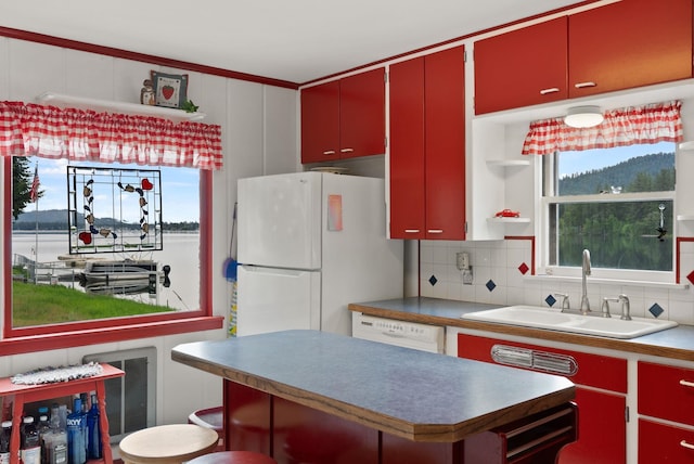 46273 Larson Beach Rd, Loon Lake, WA 99148 - kitchen featuring red cabinets, white appliances, open shelves, a sink, and backsplash