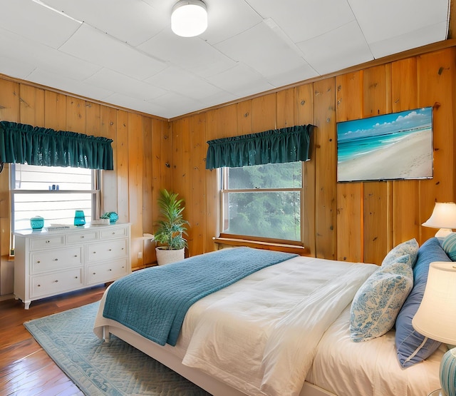 46273 Larson Beach Rd, Loon Lake, WA 99148 - bedroom with wood walls and wood finished floors