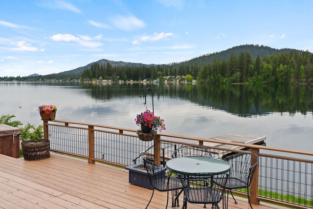 46273 Larson Beach Rd, Loon Lake, WA 99148 - wooden terrace with a water and mountain view and a view of trees