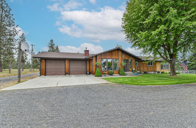 5024 E Ballard Rd, Colbert, WA 99005 - view of front facade featuring an attached garage, gravel driveway, a front yard, and a chimney