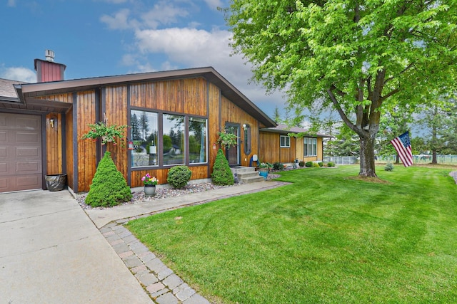 5024 E Ballard Rd, Colbert, WA 99005 - view of front facade featuring a front yard, a chimney, and concrete driveway