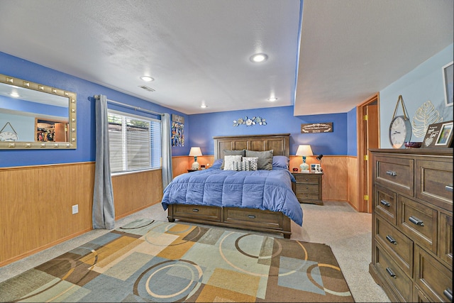 5024 E Ballard Rd, Colbert, WA 99005 - carpeted bedroom with a wainscoted wall, wood walls, recessed lighting, and a textured ceiling