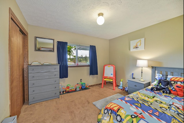5024 E Ballard Rd, Colbert, WA 99005 - bedroom featuring carpet flooring, a textured ceiling, and a closet
