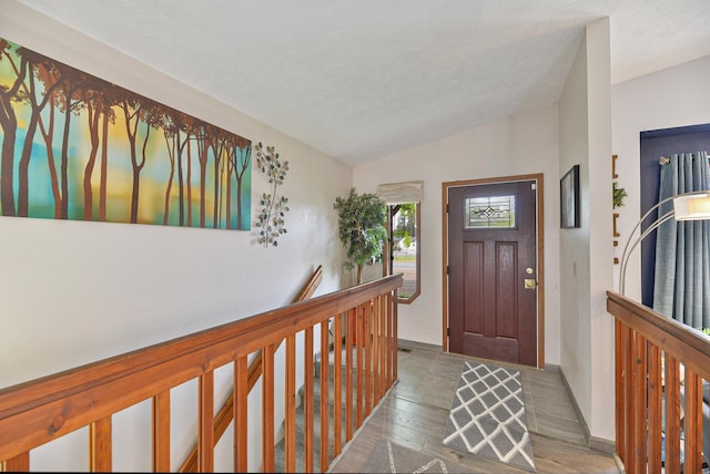 5024 E Ballard Rd, Colbert, WA 99005 - foyer entrance with lofted ceiling, wood finished floors, and a textured ceiling