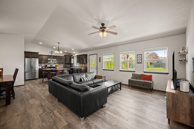 1516 E First Ct, Deer Park, WA 99006 - living area featuring vaulted ceiling, ceiling fan, wood finished floors, a chandelier, and recessed lighting