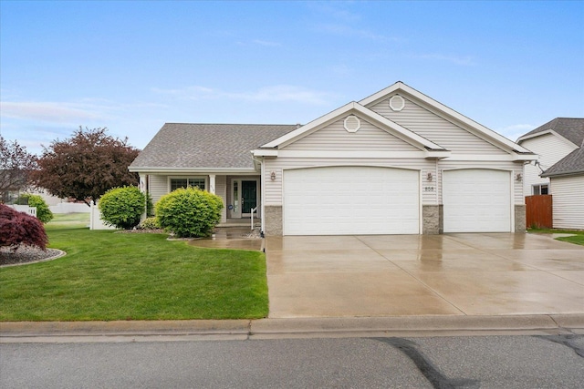 858 S Shelley Lake Ln, Spokane Valley, WA 99037 - view of front of home featuring a front lawn, an attached garage, driveway, and a shingled roof