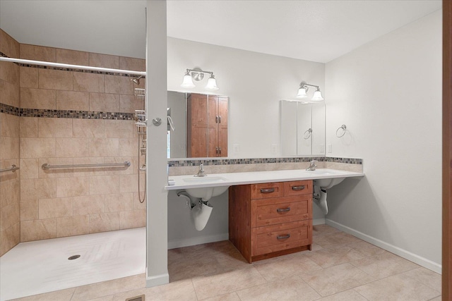 858 S Shelley Lake Ln, Spokane Valley, WA 99037 - full bathroom with tile patterned flooring, tiled shower, double sink, and baseboards