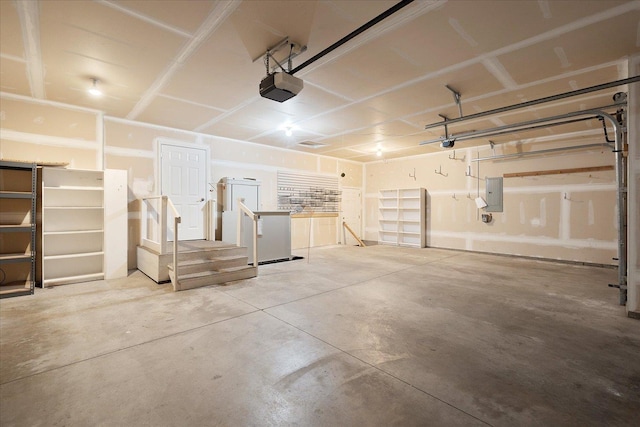 858 S Shelley Lake Ln, Spokane Valley, WA 99037 - garage featuring electric panel and a garage door opener