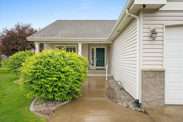 858 S Shelley Lake Ln, Spokane Valley, WA 99037 - doorway to property with a garage, a shingled roof, and a yard