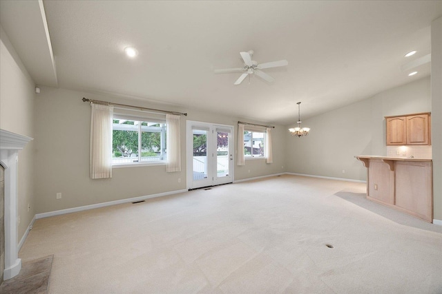 858 S Shelley Lake Ln, Spokane Valley, WA 99037 - unfurnished living room with vaulted ceiling, ceiling fan, a chandelier, healthy amount of natural light, and baseboards