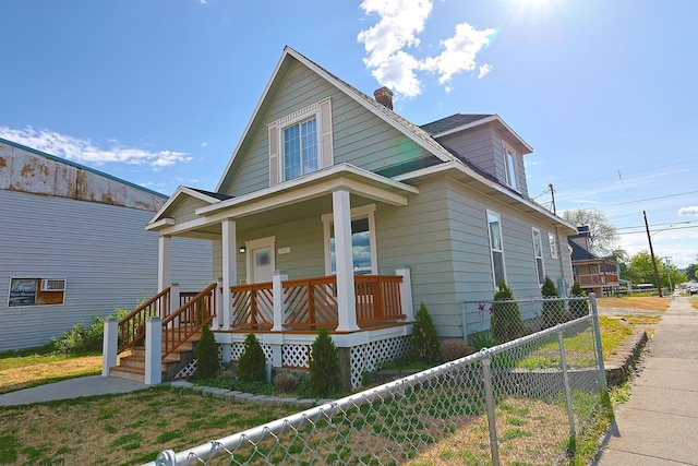 1327 N Howard St, Spokane, WA 99201 - view of front of home featuring covered porch and a chimney