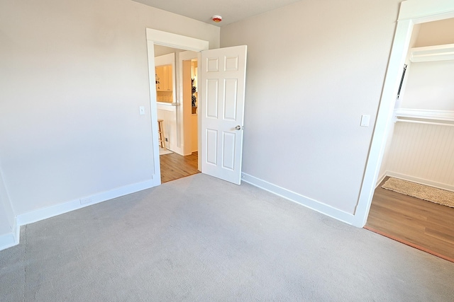 1327 N Howard St, Spokane, WA 99201 - unfurnished bedroom with carpet, baseboards, and a closet