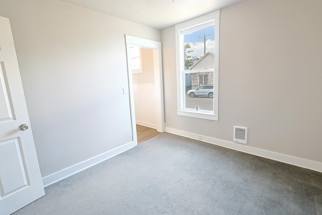 1327 N Howard St, Spokane, WA 99201 - carpeted spare room with baseboards