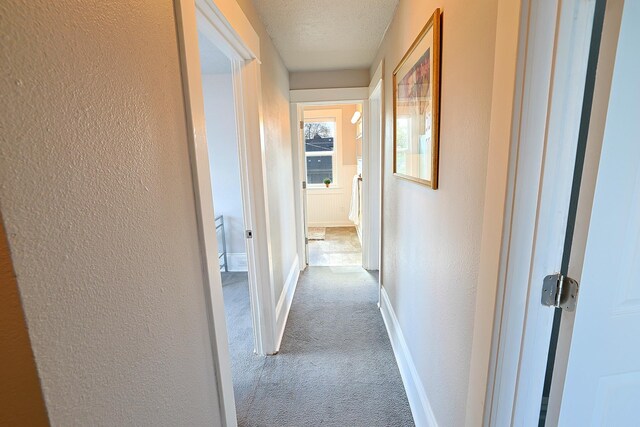 1327 N Howard St, Spokane, WA 99201 - hall featuring carpet, a textured wall, and baseboards