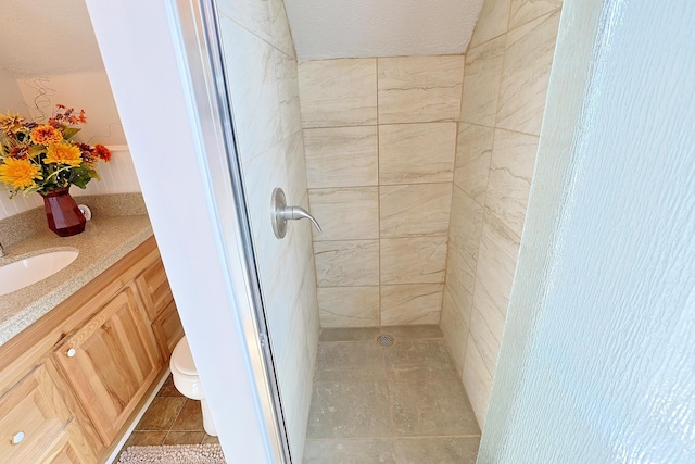 1327 N Howard St, Spokane, WA 99201 - full bath featuring a shower stall, toilet, vanity, and a textured ceiling