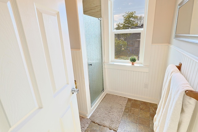 1327 N Howard St, Spokane, WA 99201 - entryway with wainscoting, stone finish flooring, and baseboards