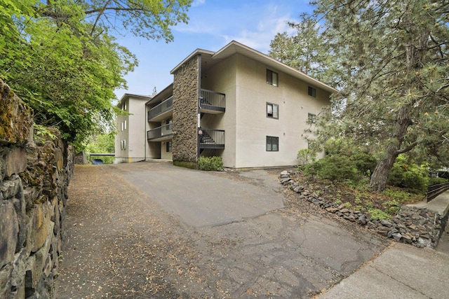 1002 W 7th Ave Unit 203, Spokane, WA 99204 - view of building exterior with driveway