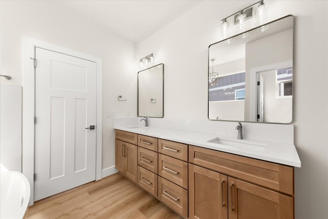 4229 W Tolliver Ct, Spokane, WA 99208 - full bath with double vanity, wood finished floors, and a soaking tub