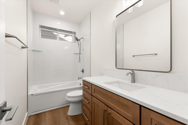 4229 W Tolliver Ct, Spokane, WA 99208 - bathroom featuring toilet, vanity, wood finished floors, washtub / shower combination, and recessed lighting