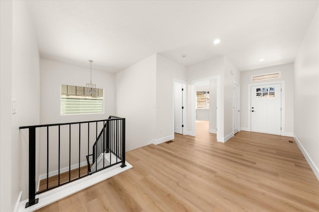 4229 W Tolliver Ct, Spokane, WA 99208 - spare room with light wood-style floors, baseboards, healthy amount of natural light, and recessed lighting
