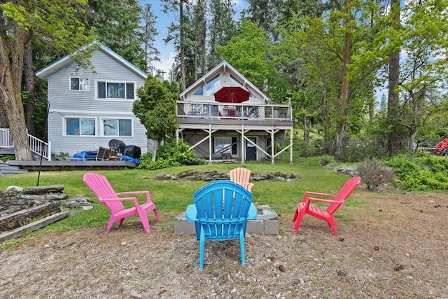 12931 N N Park St, Newman Lake, WA 99006 - rear view of property with an outdoor fire pit, a deck, and a yard