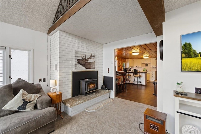 12931 N N Park St, Newman Lake, WA 99006 - living area with a wood stove, a textured ceiling, and carpet flooring
