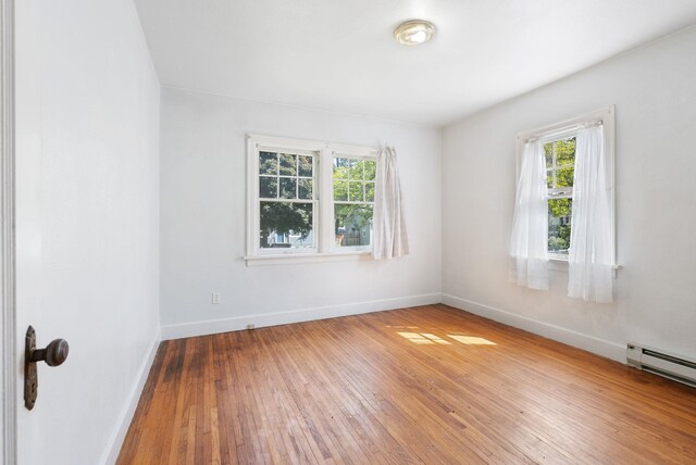 106 E 29th Avenue Corner Of 29Th & Tekoa - Entry & Garage On Tekoa, Spokane, WA 99203 - spare room featuring baseboards and wood-type flooring
