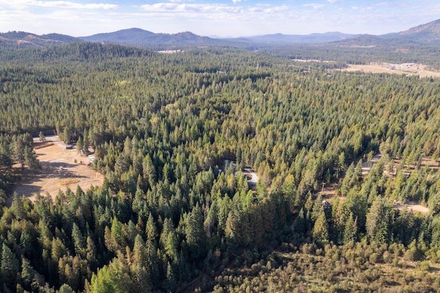 300 Duck Ln, Newport, WA 99156 - aerial view of property and surrounding area with a heavily wooded area and a mountainous background