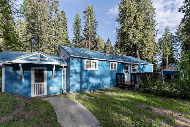 8431 Fertile Valley Rd, Newport, WA 99156 - single story home featuring metal roof, a front yard, and a wooden deck
